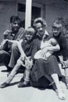 Family group on verandah of Le Chalet, Sark , 1949