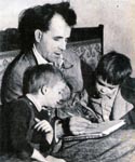 Sebastian and Fabian watch as their father draws something for them, Sark late 1940's